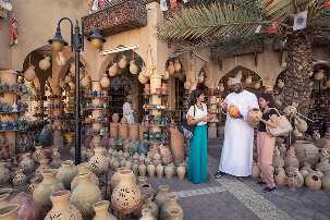 tourists at the nizwa souk, muttrah souk muscat, nizwa fort, SULTAN QABOOS GRAND MOSQUE, GRAND MOSQUE SOHAR, sohar fort, mirani fort on a road trip to oman from UAE
