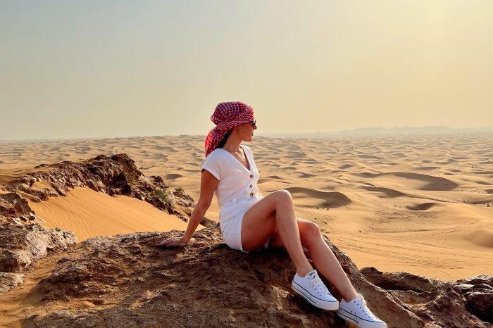 tourist from deira dubai hotels enjoying desert safari dune bashing, quad biking in dubai desert, bbq dinner, camel rides, shisha, henna tattoo, belly dancer on DESERT SAFARI FROM DEIRA DUBAI